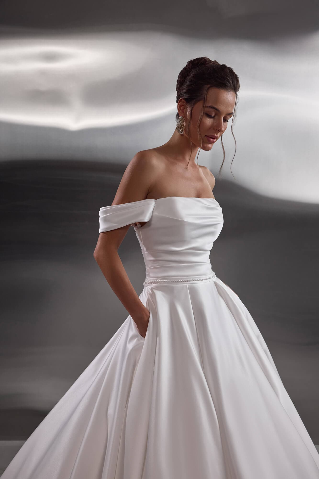 Elegant satin mermaid wedding dress Easton with sculpted corset, minimalist silhouette and graceful chapel train.